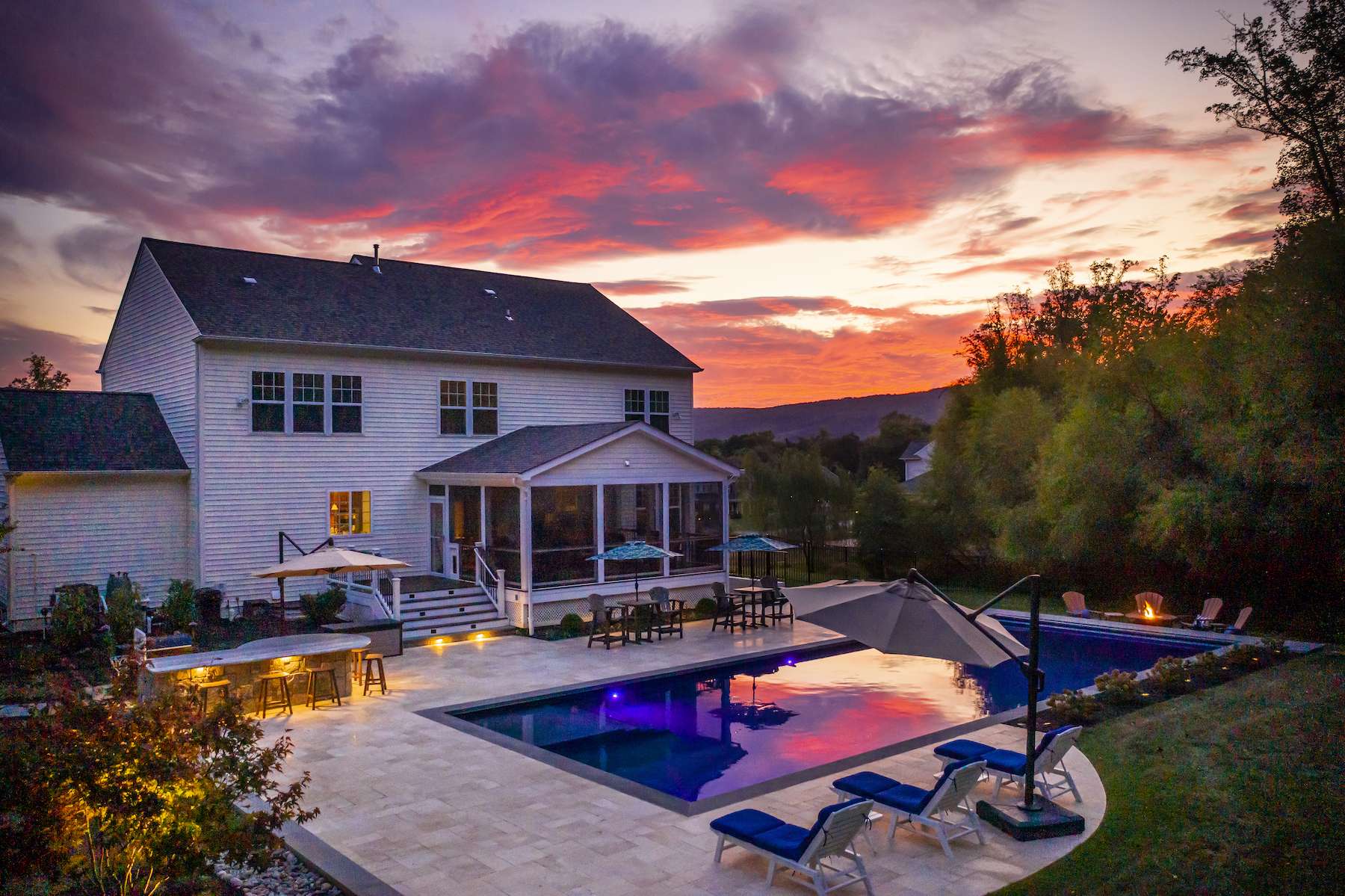 pool with patio and outdoor kitchen