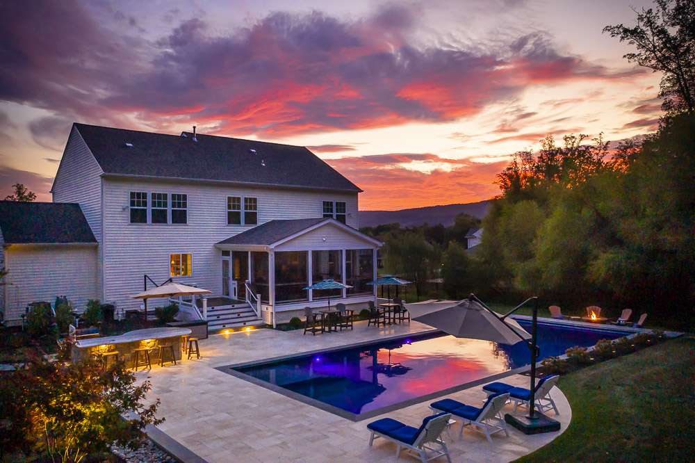 Pool and patio with landscape lighting