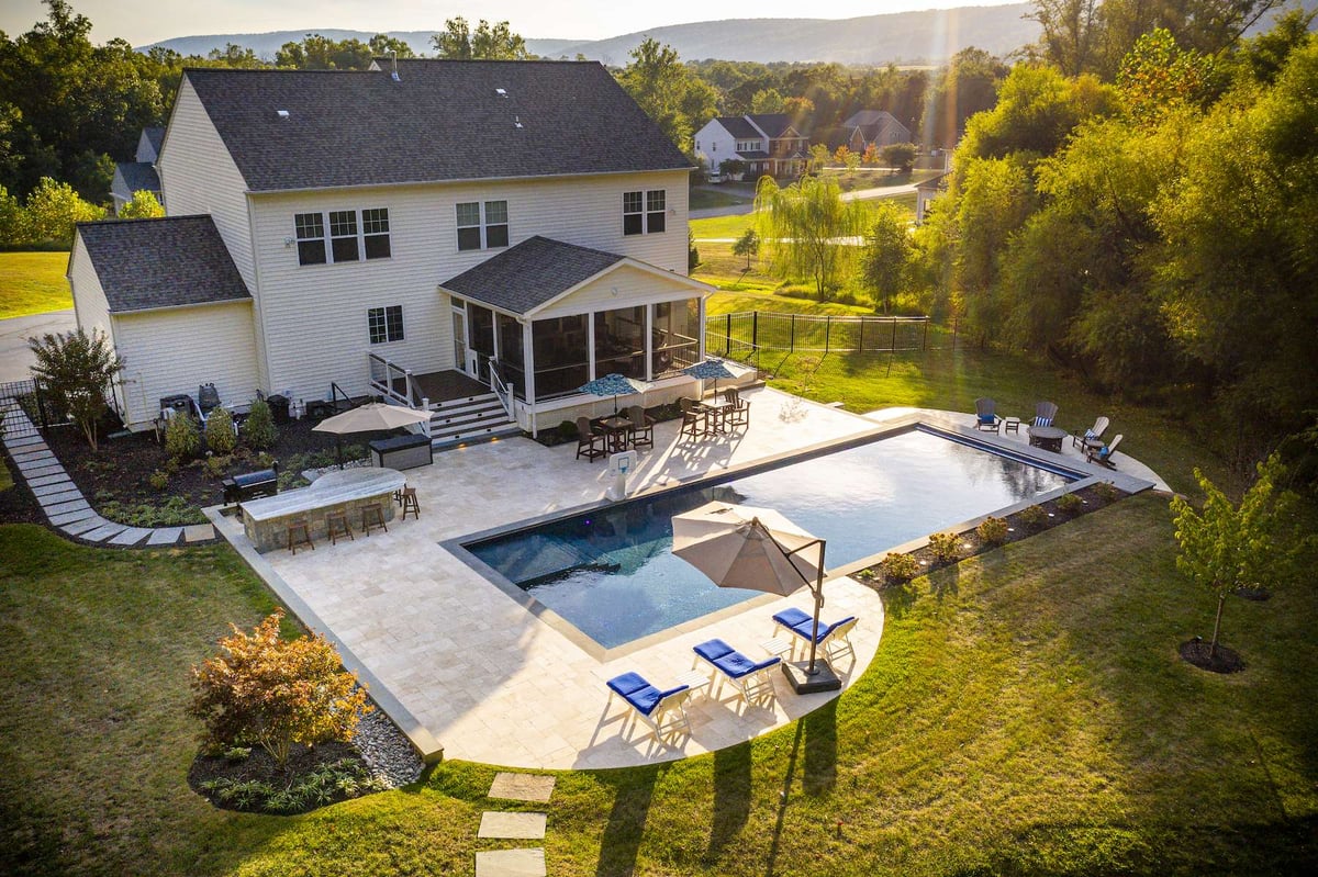 pool with patio and outdoor seating area