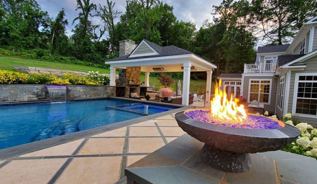 pool with pavilion and fire pit
