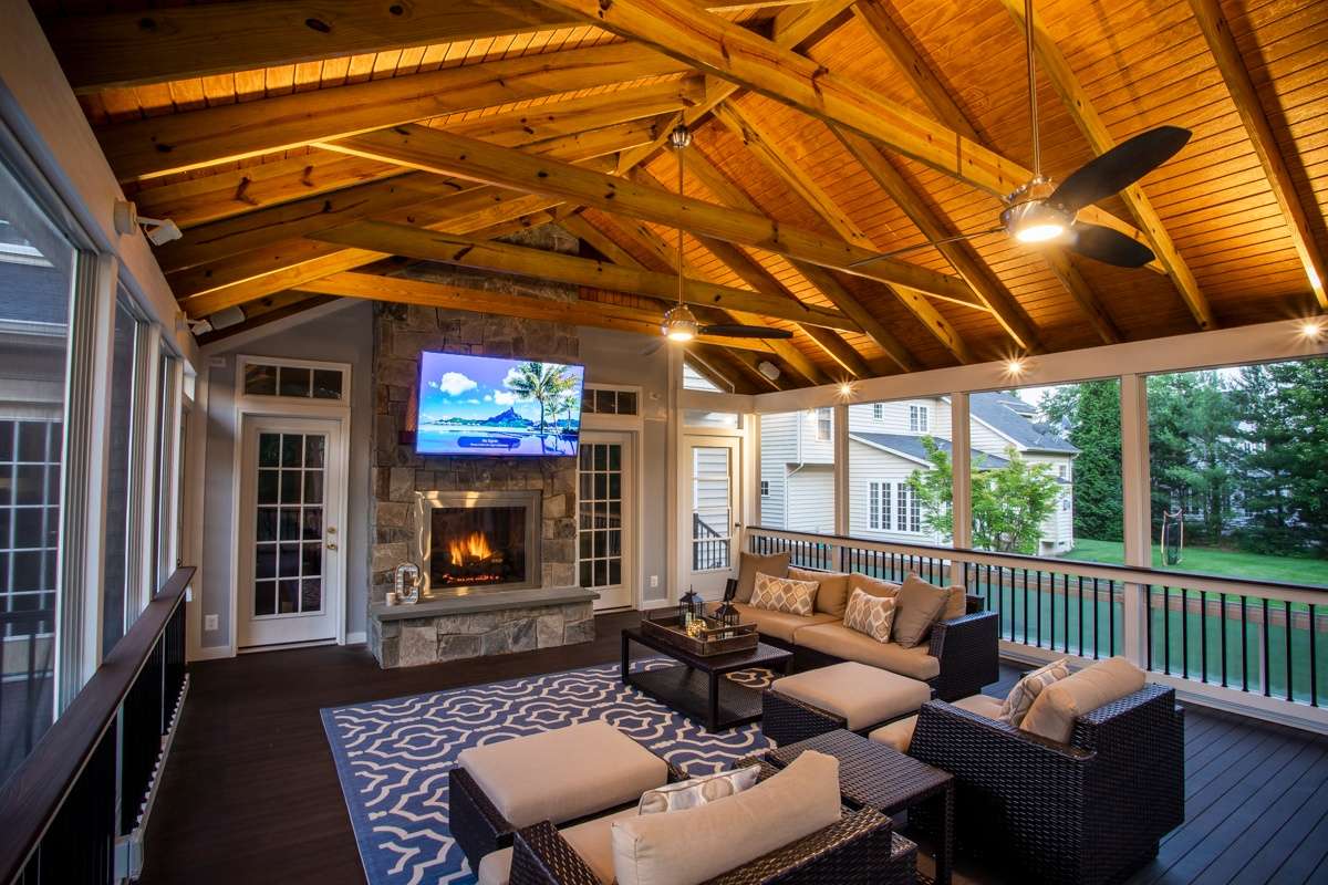 three seasons screened porch with TV and fireplace in Ashburn, VA