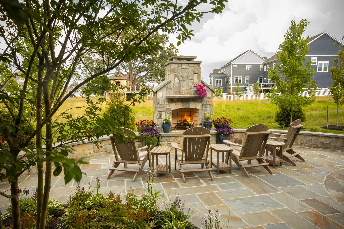 patio and outdoor fireplace designed by Rock Water Farm