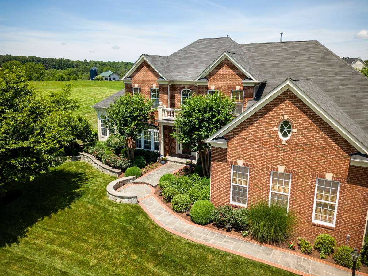 Beautiful house and landscape with walkway in Leesburg, VA