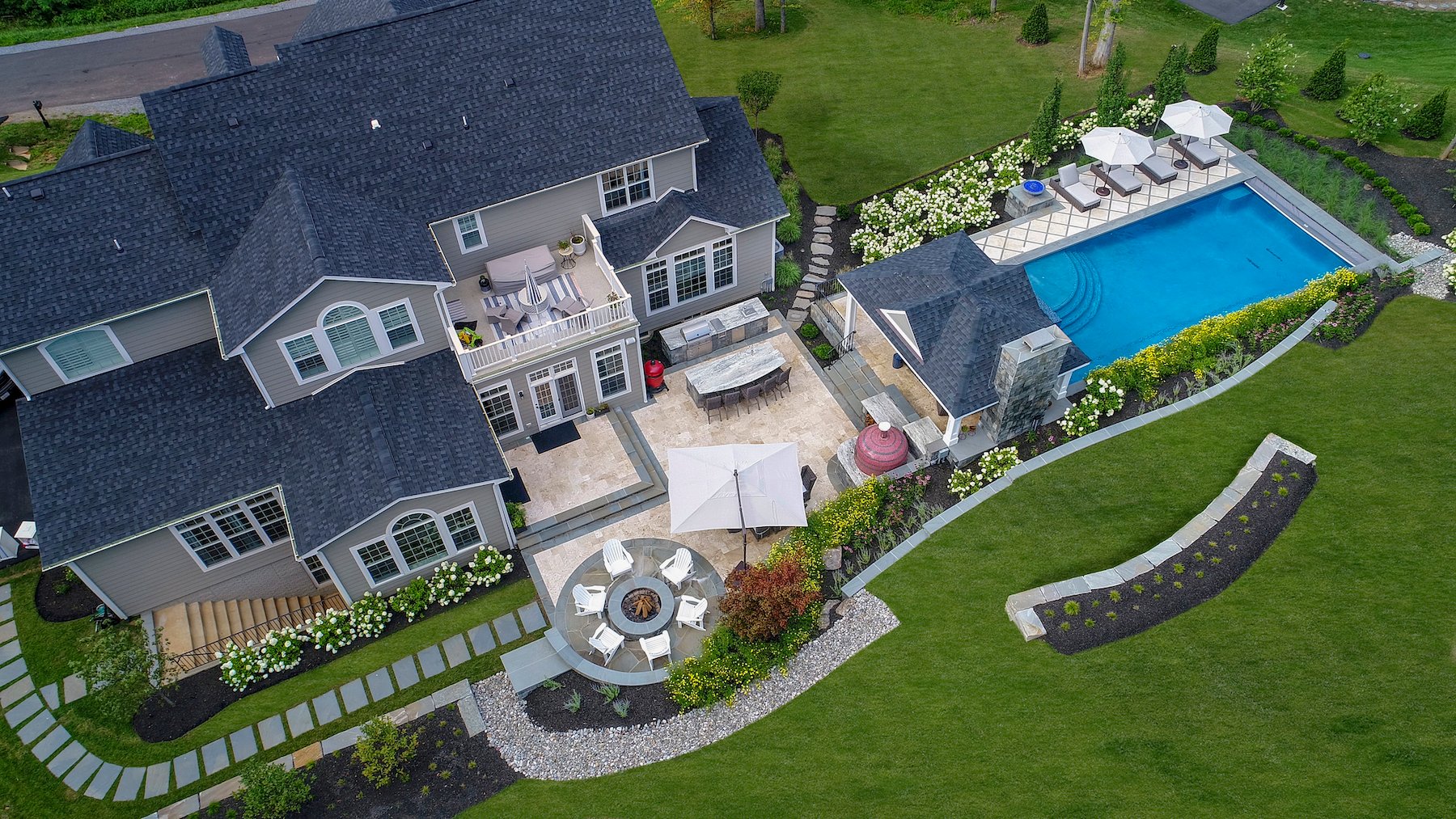 Aerial-landscape-pool-hottub-patio-pergola-outdoor kitchen-planting-seating-pizza oven