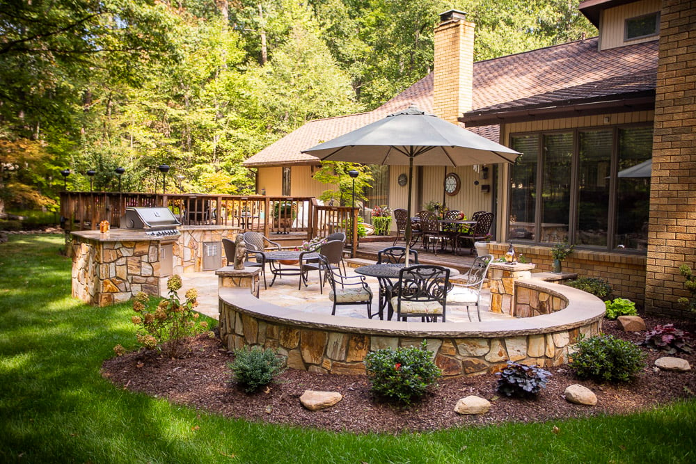 Patio with kitchen and seating wall